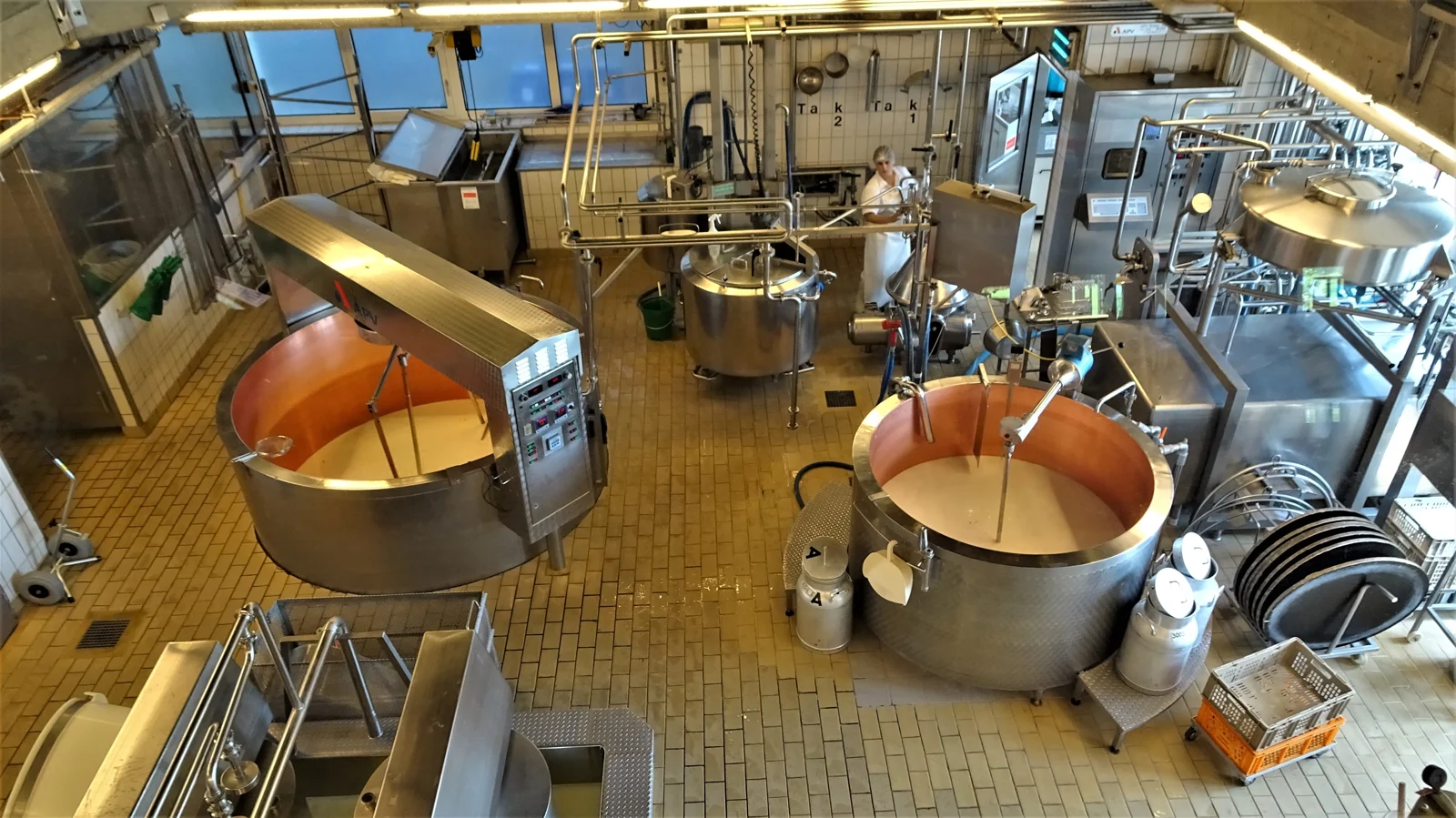 Cheese production vats and equipment in a working Emmental dairy